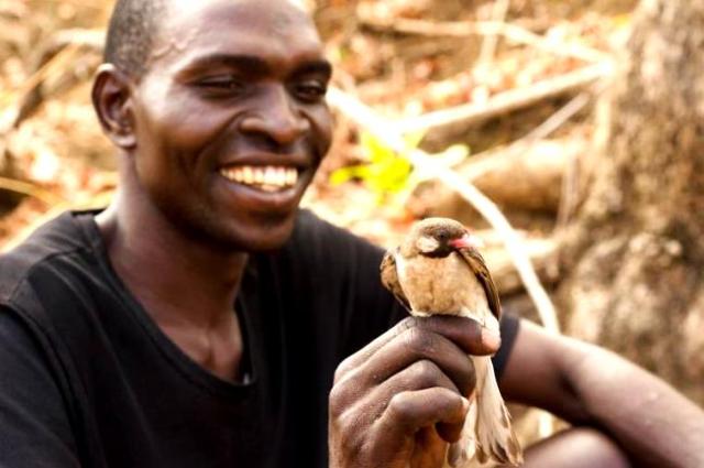 Yao hunter with honeyguide - Claire Spottiswoode